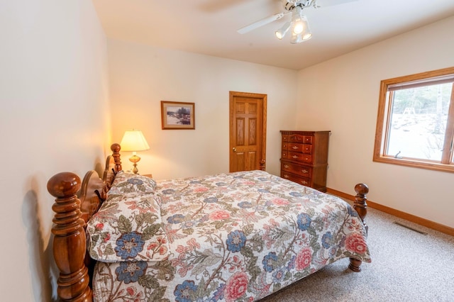 bedroom featuring carpet flooring, ceiling fan, visible vents, and baseboards