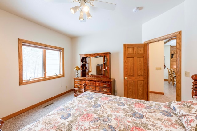 bedroom with light colored carpet, visible vents, ceiling fan, and baseboards