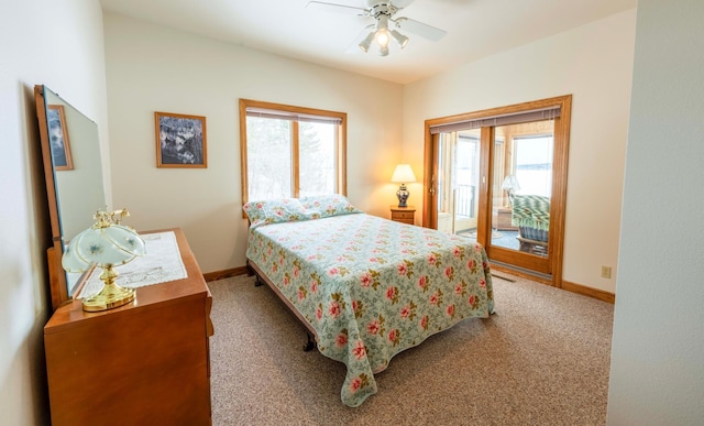 bedroom with multiple windows, carpet, and access to exterior