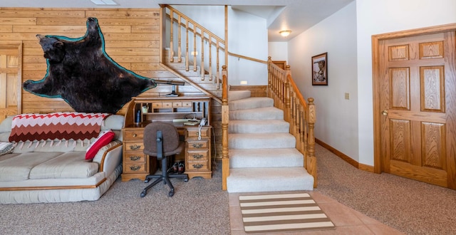 interior space featuring carpet and baseboards