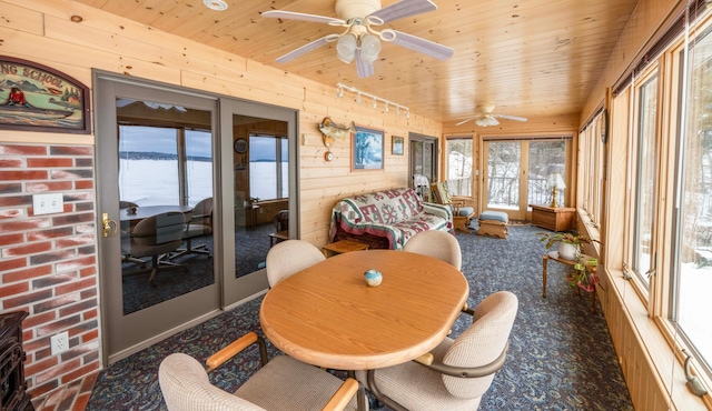 sunroom / solarium featuring wooden ceiling