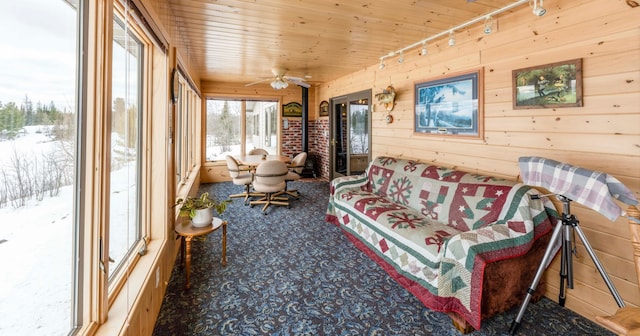 sunroom / solarium featuring wooden ceiling, a ceiling fan, and track lighting