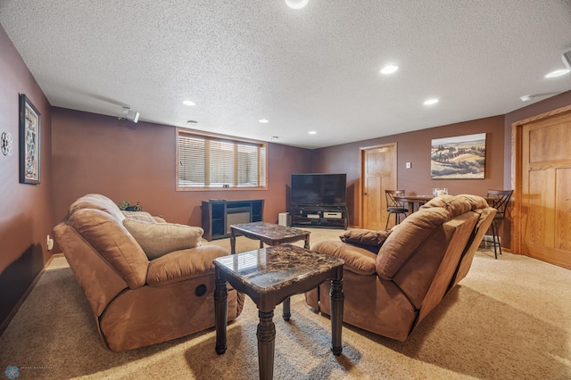 living area with a textured ceiling, baseboards, carpet flooring, and recessed lighting