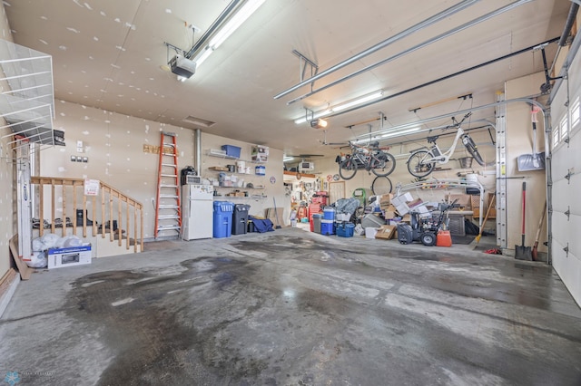 garage featuring a workshop area and a garage door opener