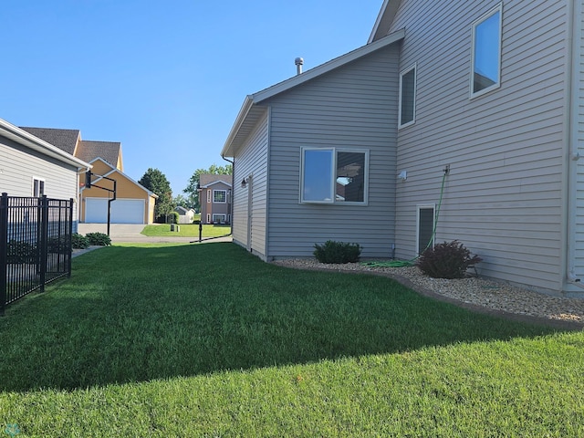 view of yard with an outdoor structure and fence