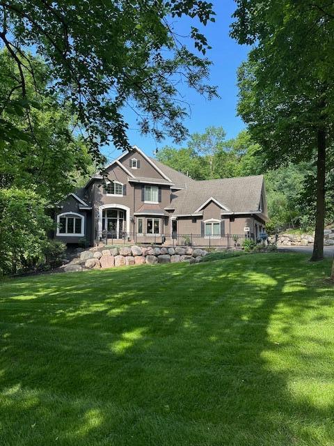 6155 Murray Ct, Shorewood, MN 55331 - rear view of property with a lawn