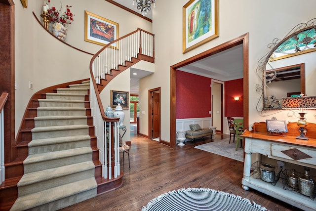 6155 Murray Ct, Shorewood, MN 55331 - foyer entrance featuring stairs, wood finished floors, wainscoting, and a high ceiling