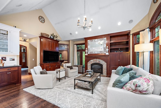 6155 Murray Ct, Shorewood, MN 55331 - living room featuring high vaulted ceiling, dark wood-style floors, a glass covered fireplace, a chandelier, and recessed lighting