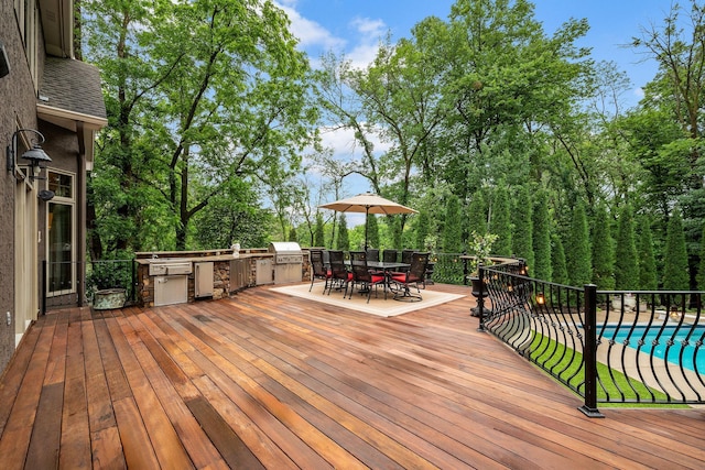 6155 Murray Ct, Shorewood, MN 55331 - wooden deck with exterior kitchen and outdoor dining space