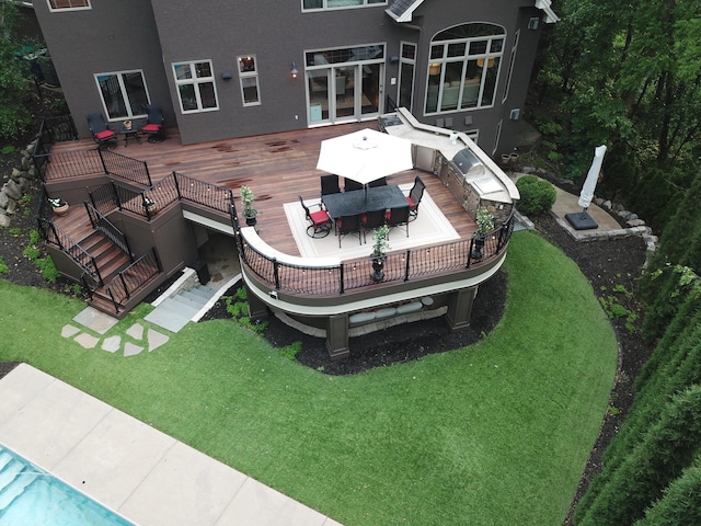 6155 Murray Ct, Shorewood, MN 55331 - back of property with a deck, stucco siding, outdoor dining space, and a yard