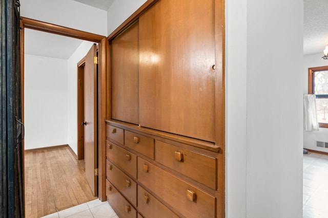 details featuring baseboards and visible vents