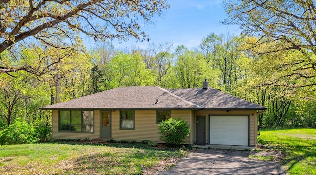 7624 Pioneer Rd, Wyoming, MN 55092 - view of front of home with an attached garage, driveway, a chimney, a shingled roof, and a front yard