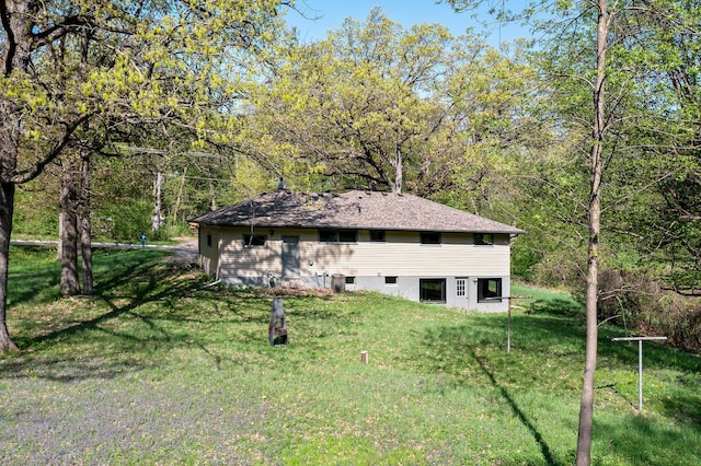 7624 Pioneer Rd, Wyoming, MN 55092 - back of house featuring a lawn and a view of trees