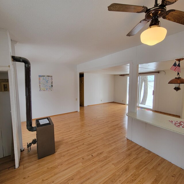 43404 Bills Beach Rd, Edna Twp, MN 56528 - unfurnished living room with light wood finished floors, ceiling fan, and a textured ceiling