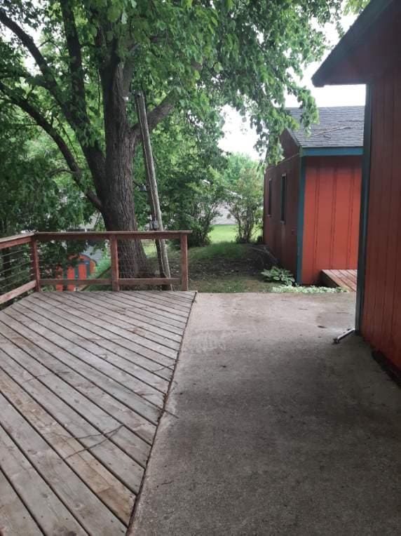 43404 Bills Beach Rd, Edna Twp, MN 56528 - wooden deck with a patio