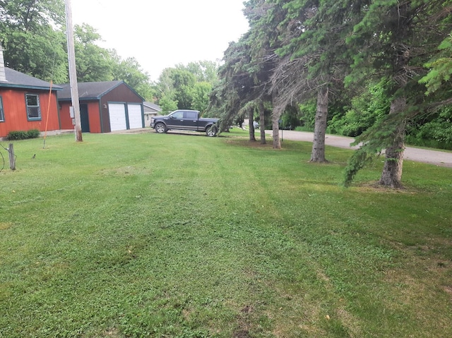 43404 Bills Beach Rd, Edna Twp, MN 56528 - view of grassy yard with driveway