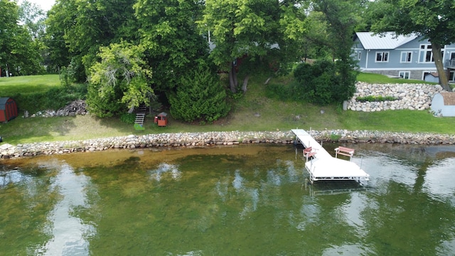 43404 Bills Beach Rd, Edna Twp, MN 56528 - dock featuring a water view and a lawn
