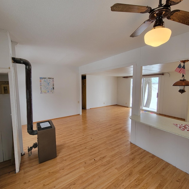 43404 Bills Beach Rd, Edna Twp, MN 56528 - unfurnished living room with light wood finished floors, a textured ceiling, and a ceiling fan