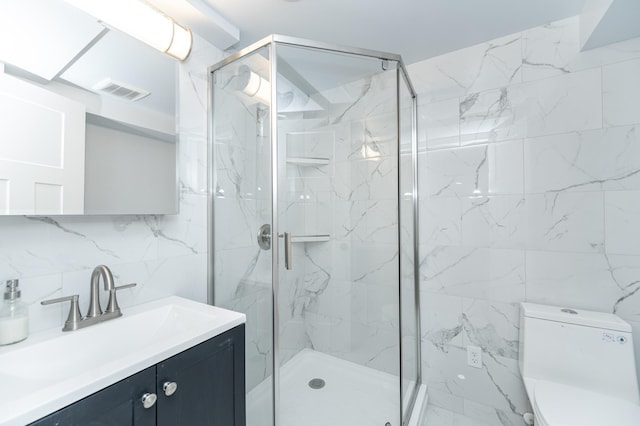 bathroom with a stall shower, tasteful backsplash, visible vents, toilet, and vanity