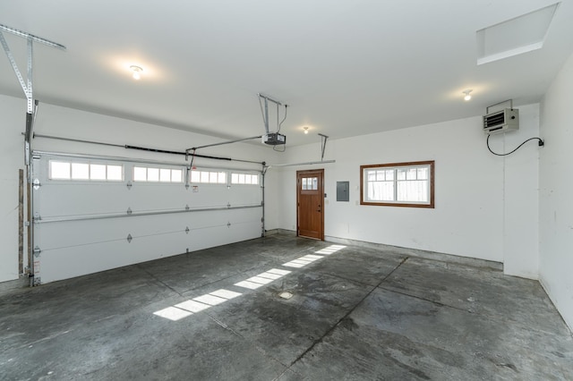 garage featuring a garage door opener and electric panel