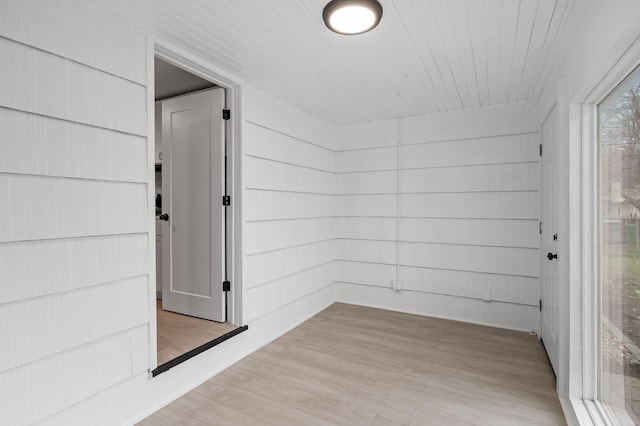 interior space with wooden ceiling and light wood-style flooring