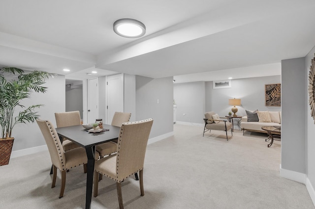 dining room featuring recessed lighting, baseboards, and light colored carpet