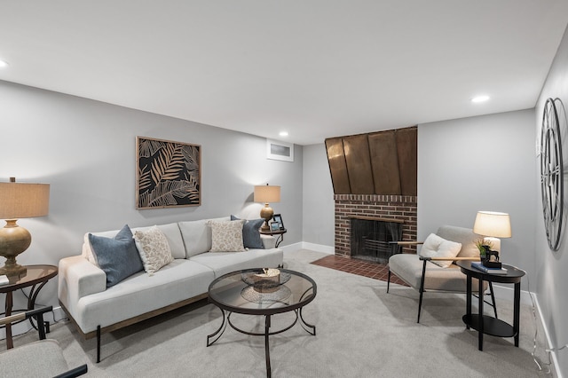 living area featuring recessed lighting, light carpet, a fireplace, and baseboards