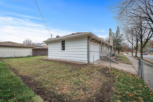 view of side of property featuring an attached garage, fence, concrete driveway, a yard, and a chimney