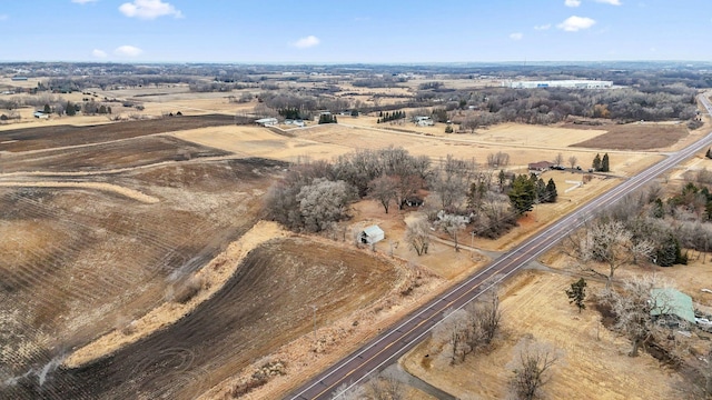 birds eye view of property featuring a rural view