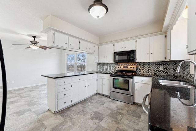 kitchen with black microwave, a peninsula, a sink, electric stove, and decorative backsplash