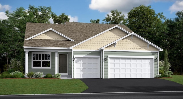 view of front of house with a garage, driveway, roof with shingles, and a front yard