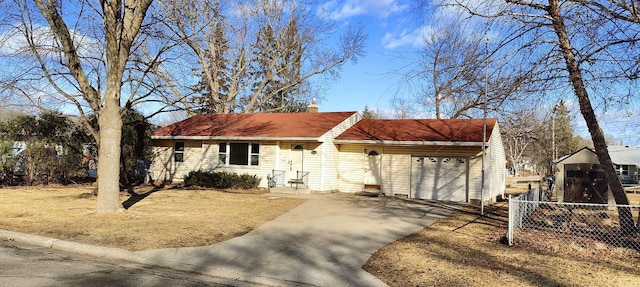 single story home with a chimney, entry steps, fence, a garage, and driveway