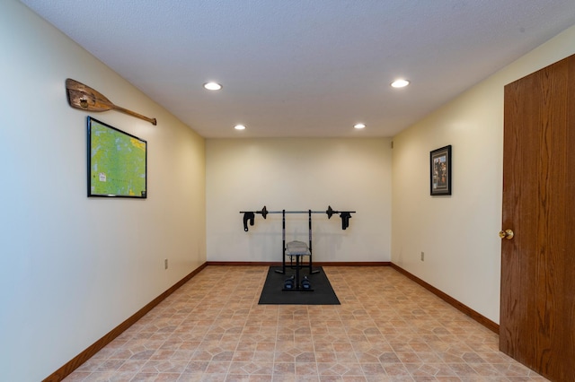 workout room with baseboards and recessed lighting