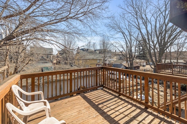 wooden deck featuring a residential view