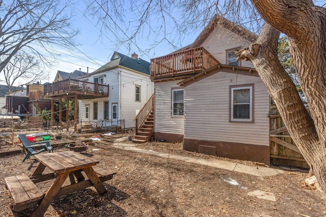 back of house featuring a deck