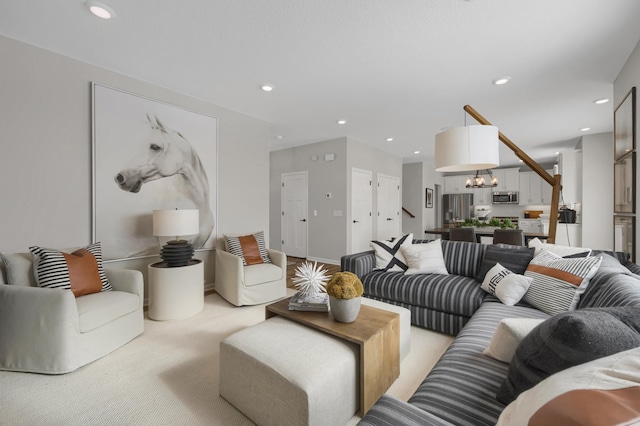 living area with a chandelier and recessed lighting