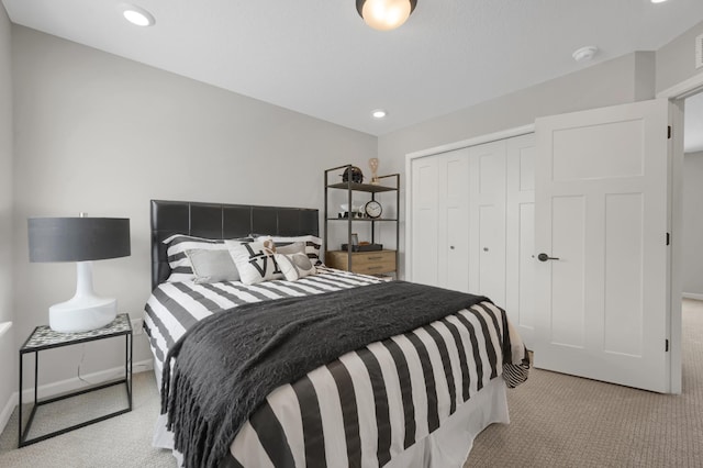 bedroom with visible vents, baseboards, light colored carpet, a closet, and recessed lighting