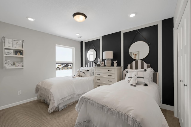 carpeted bedroom featuring baseboards and recessed lighting