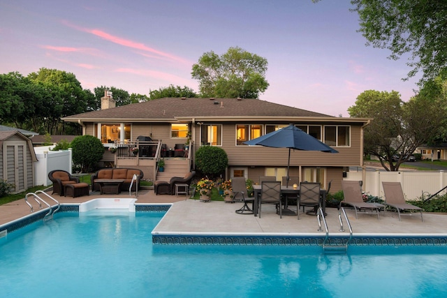 view of pool with a patio area and a fenced in pool