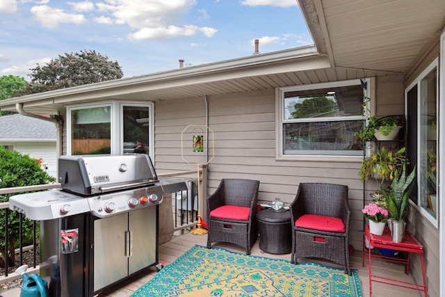 view of patio with a grill and a wooden deck