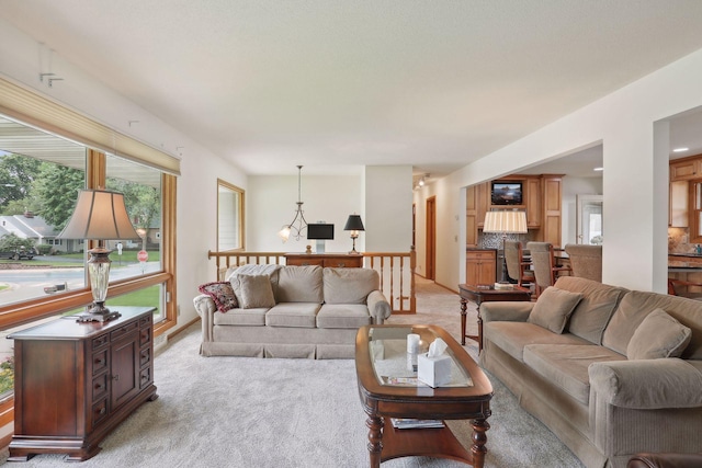 living area featuring light colored carpet