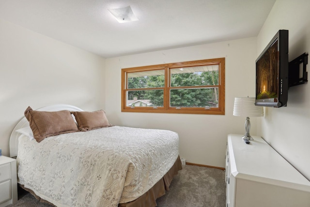 bedroom with carpet and baseboards