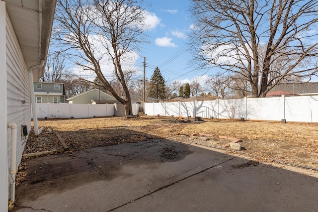 view of yard with a patio area and a fenced backyard