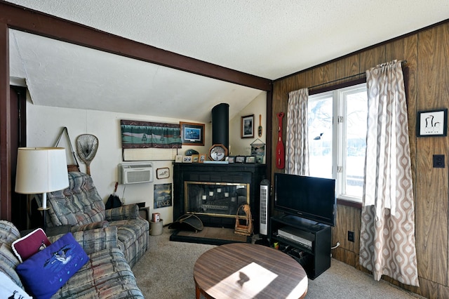 living room featuring wooden walls, a wealth of natural light, vaulted ceiling with beams, and a textured ceiling