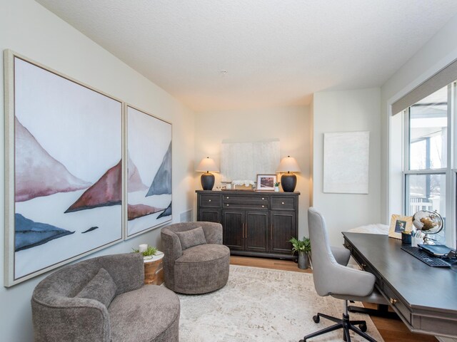 home office with wood finished floors