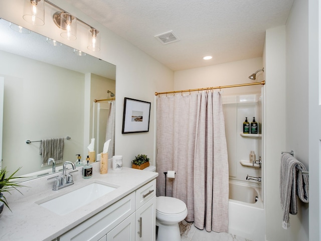 bathroom featuring toilet, visible vents, shower / bath combination with curtain, and vanity