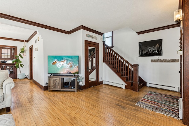 living area featuring stairs, wood-type flooring, and a baseboard radiator