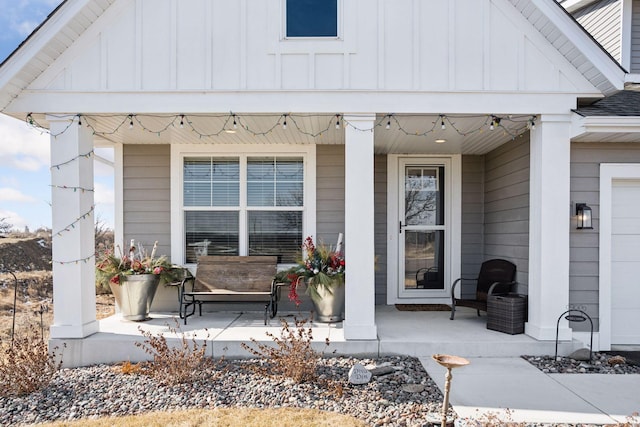 exterior space featuring a shingled roof, a porch, and board and batten siding