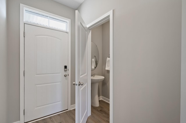 entryway with wood finished floors