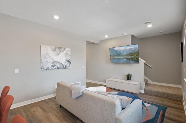 living area featuring stairs, baseboards, wood finished floors, and recessed lighting